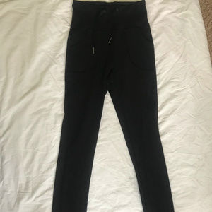 black lululemon pants with high/low waist band